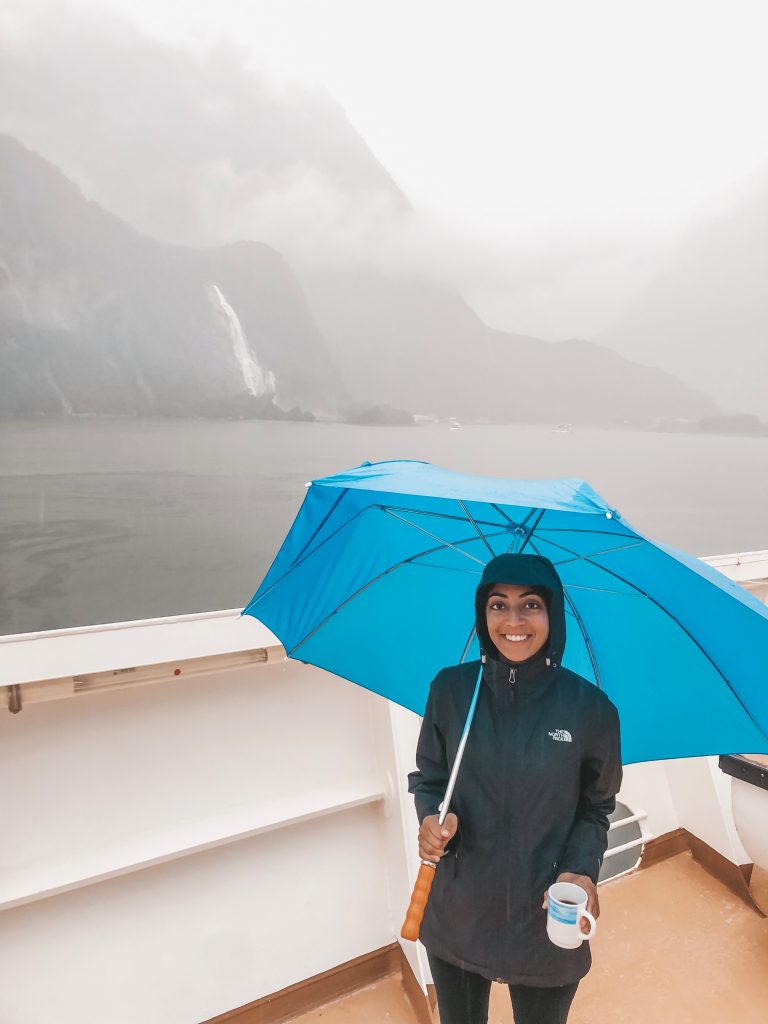 A photo of me wearing a black rainjacket that I take with me everywhere.