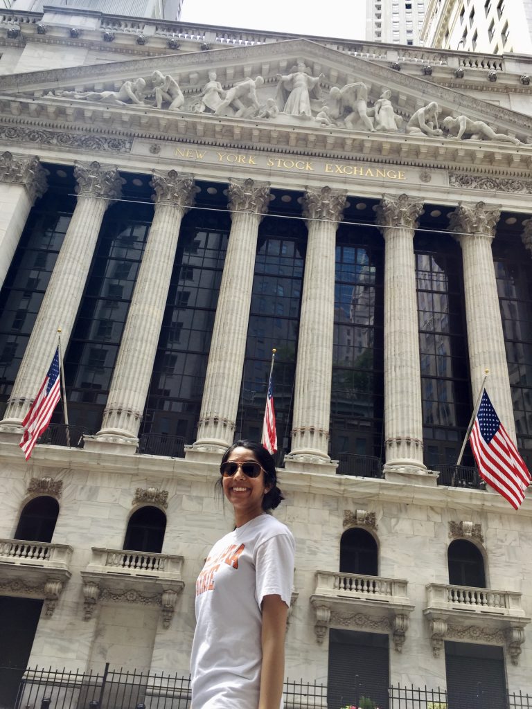 Me standing in front of the stock exchange in New York City — add this on your three-day itinerary for New York City