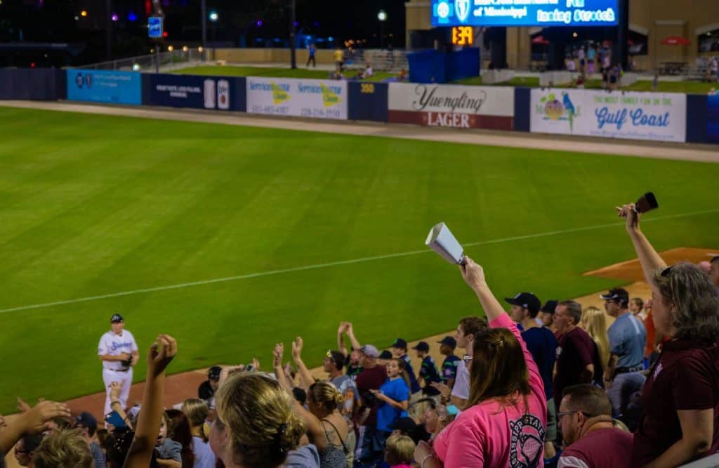 Fans cheering on the Biloxi Shuckers baseball game at MGM Park which is one of several fun things to do in Biloxi Mississippi.