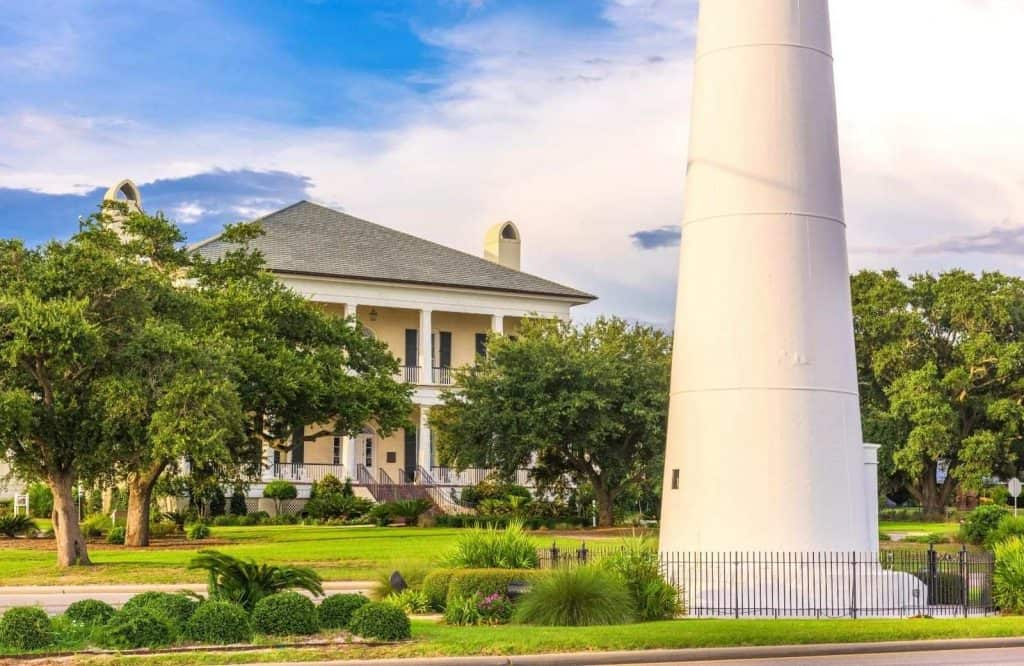 Biloxi Visitors Center behind the lighthouse on a perfectly manicured lawn which is one of the most fun things to do in Biloxi.
