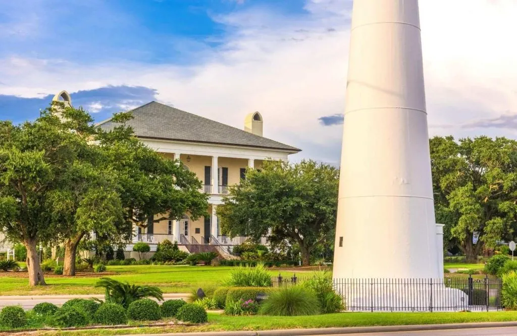Biloxi Visitors Center behind the lighthouse on a perfectly manicured lawn which is one of the most fun things to do in Biloxi.