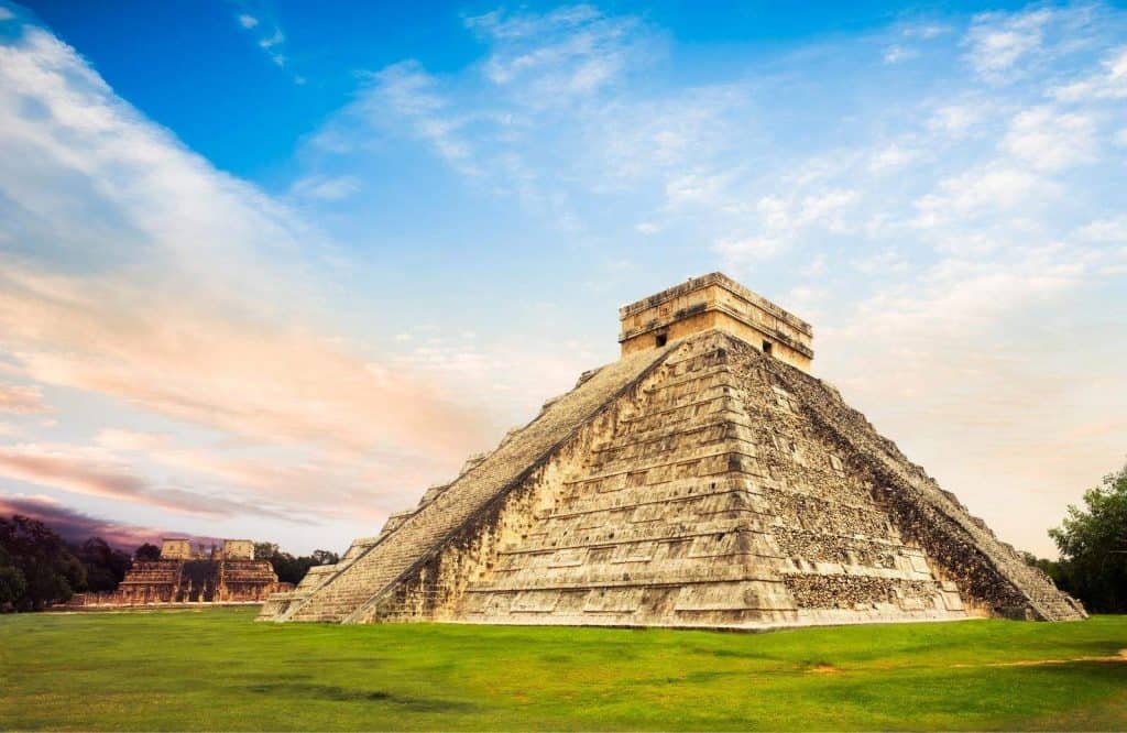 Chichen Itza below blue skies and it's important to factor in Mayan ruins when creating your packing list for Tulum Mexico.