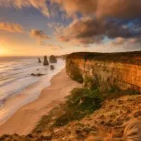 Cliffs along the beach at sunset or sunrise for the best Great Ocean Road stops.