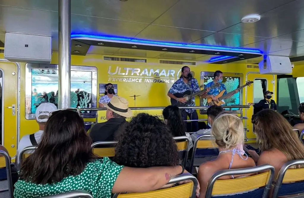 Singers and a band entertaining passengers from Cozumel to Playa del Carmen.