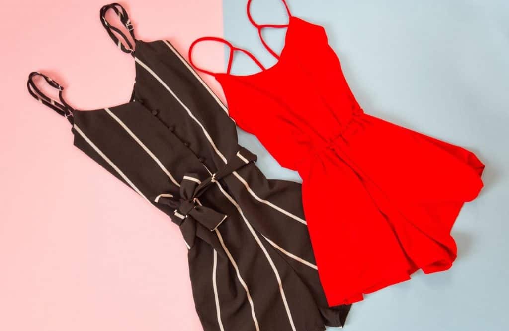 A red romper and a black striped romper which you should add to your packing list for Tulum.