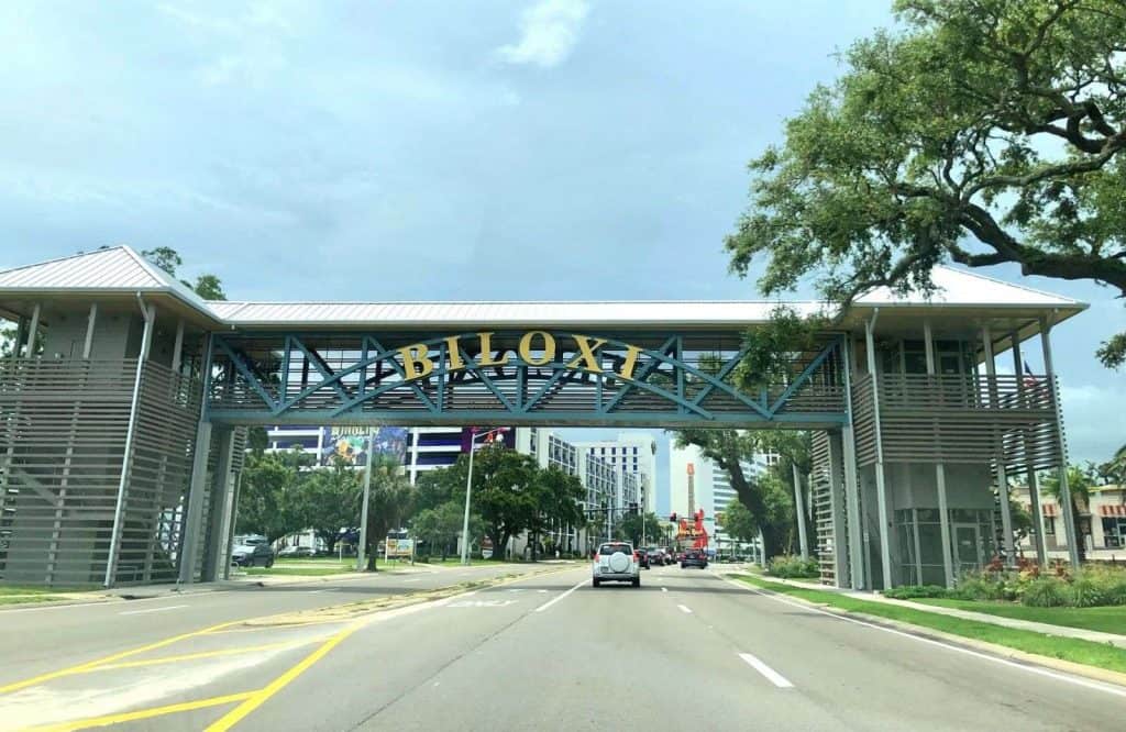 The official entrance of Biloxi with a building that extends both sides of the road; getting a photo here is one of the best things to do in Biloxi.