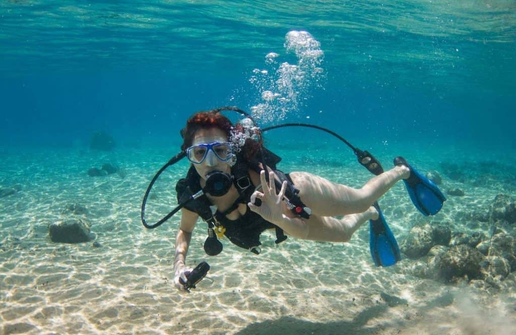 A woman diving and is Cozumel Mexico safe for diving.