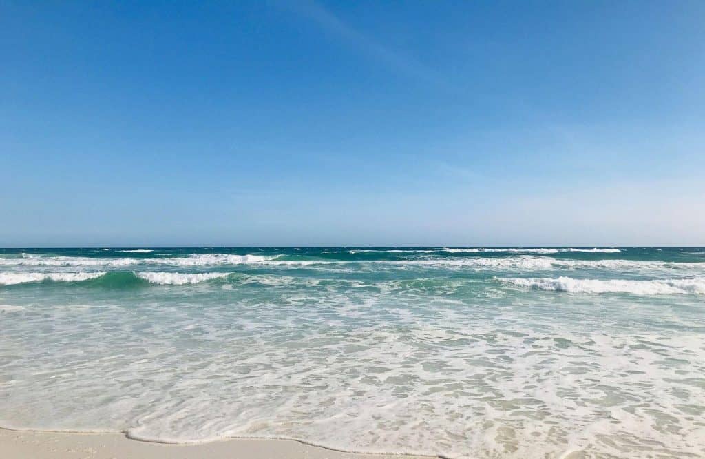 Gorgeous baby blue waters of Grayton Beach State Park, which is one of the best beaches in the Florida Panhandle.