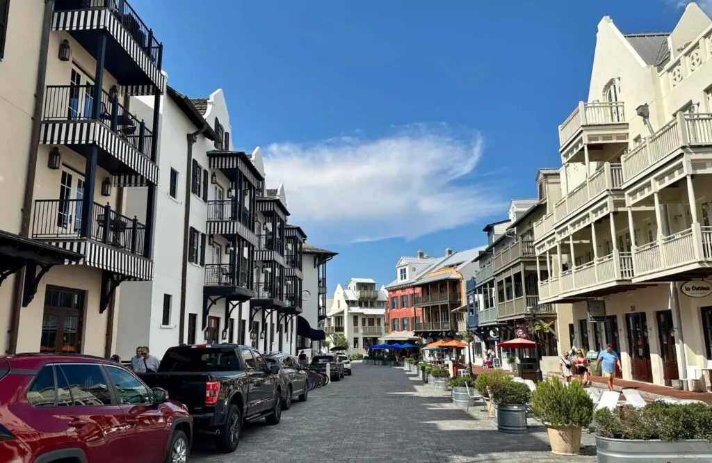Cobblestone streets of Rosemary Beach, Florida with European architecture buildings consisting of shops and restaurants.