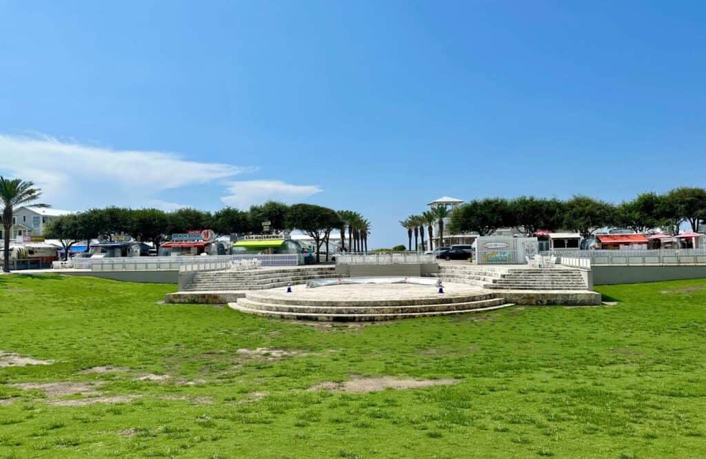 An outdoor amphitheater in Seaside, Florida perched on lush green grass.