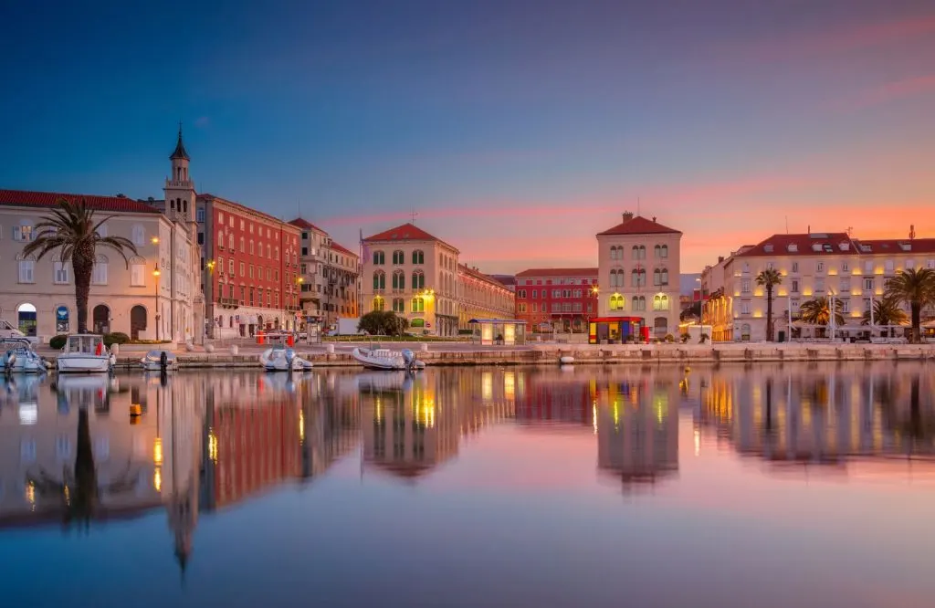 The city of Split along the water at sunrise.