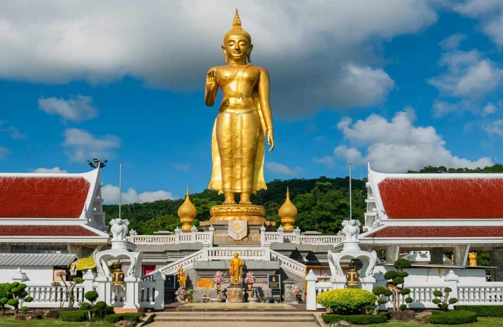 Gold, towering statue of Buddha in Hat Yai, which is one of the most unique places in Thailand.