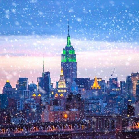 Snowy skyline of the city for a NYC Christmas bucket list.