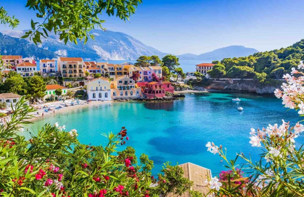 Crystal clear blue waters and a town nestled along the shoreline of Kefalonia.