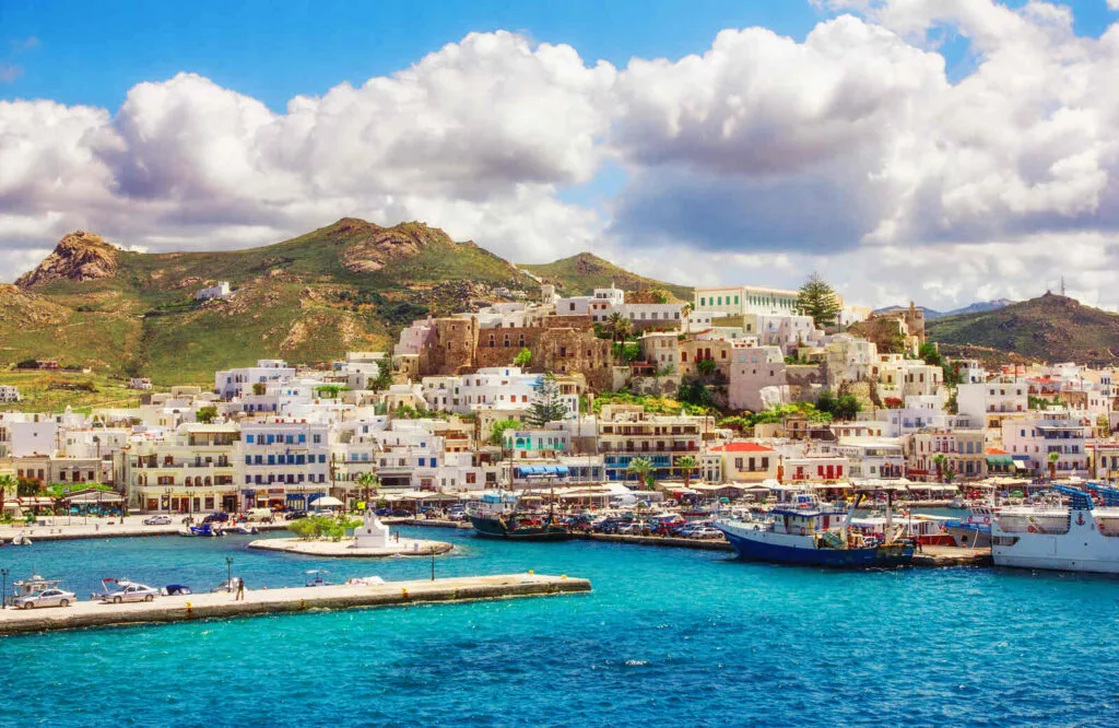 The port of Naxos and bright blue waters making Naxos one of the best islands in Greece for couples.