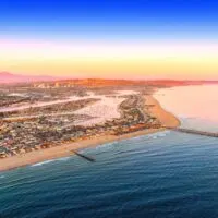 Aerial view of Newport Beach with golden sand and blue waters, which is one of the best day trips from Los Angeles.