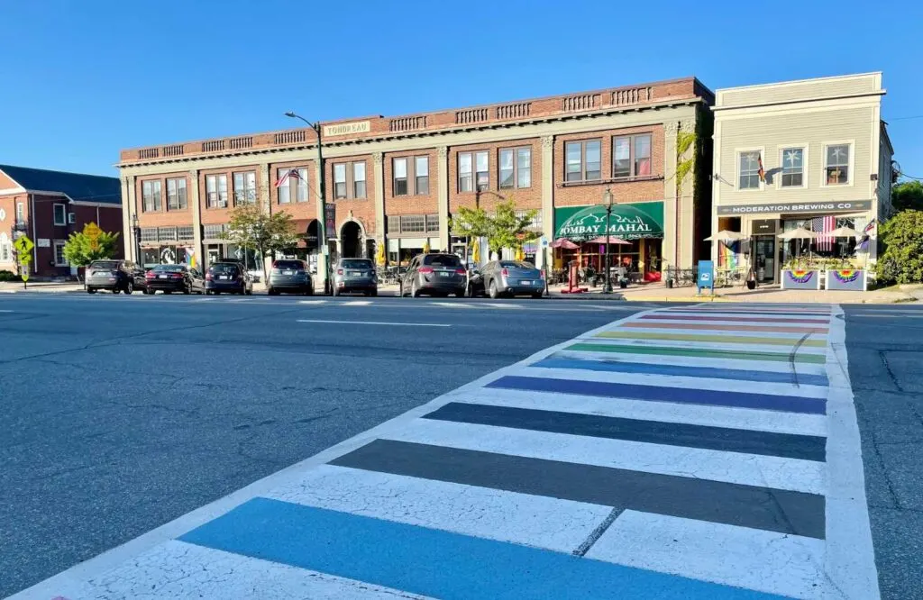 A crosswalk with restaurants and shops in downtown Brunswick, Maine.