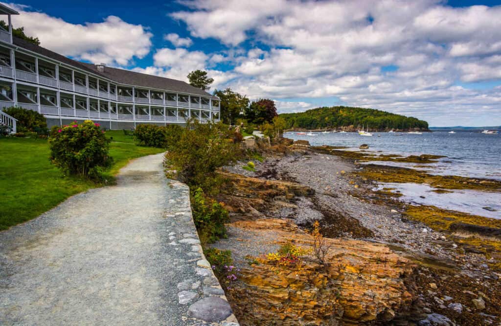 A path along the waterfront with a hotel known as the Bar Harbor Shore Path.