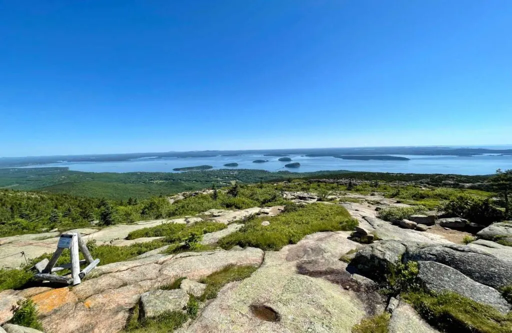 View from the top of a mountain with several small islands in the bay, which is Frenchman Bay in Bar Harbor.